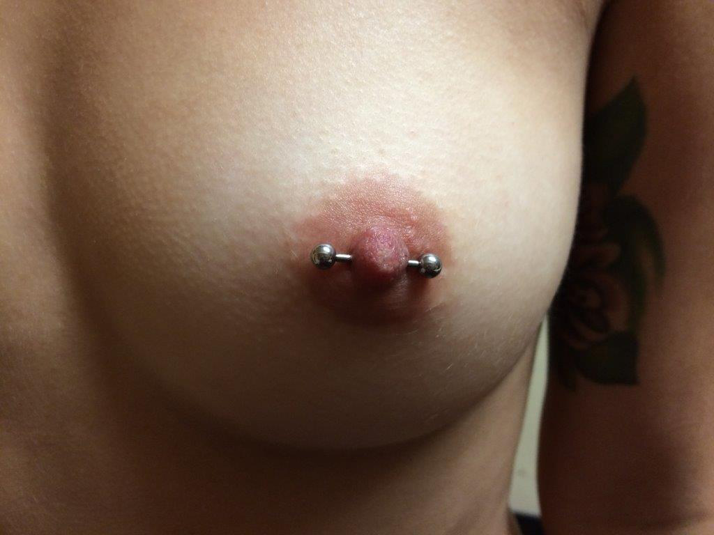 Blonde nipple piercing